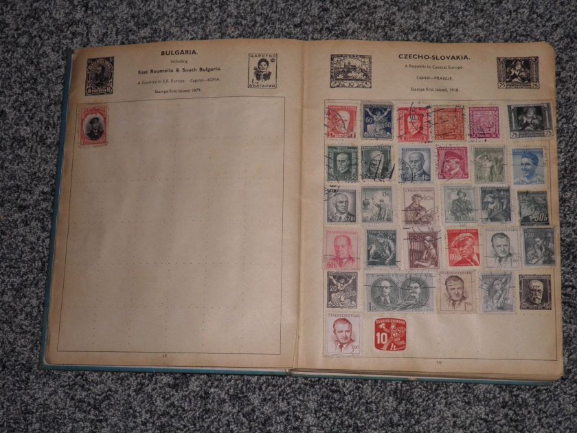 L89   A OLD IMPROVED POSTAGE STAMP ALBUM WITH EARLY MID ALL WORLD 