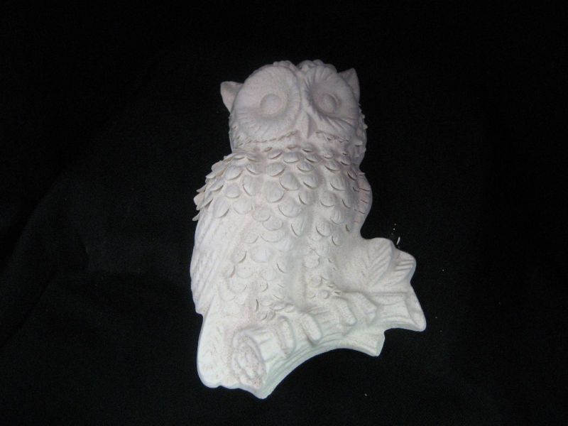 Bisque Ceramic owl with raised feathers hangs on wall  